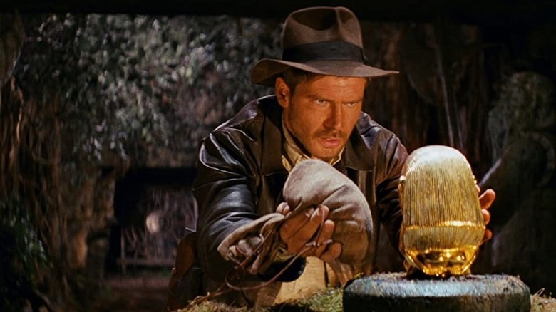 Indiana Jones switching out a golden idol for a bag of sand in "Raiders of the Lost Ark"