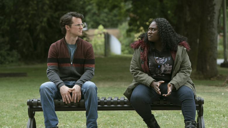 Peacemaker star Freddie Stroma on a bench