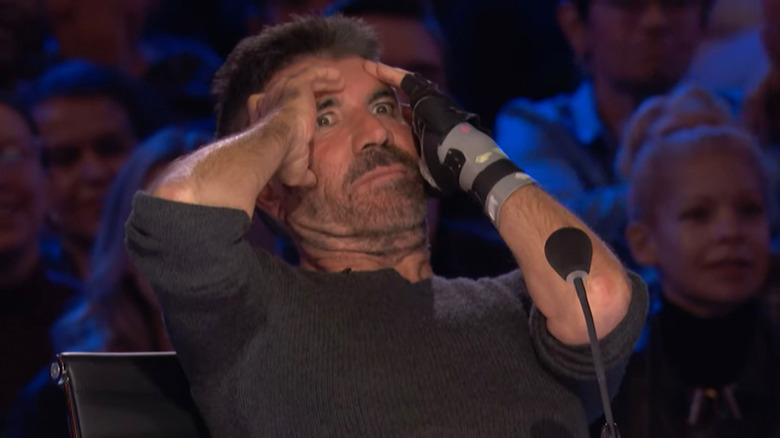 Simon Cowell recoils in disgust during a taping of America's Got Talent