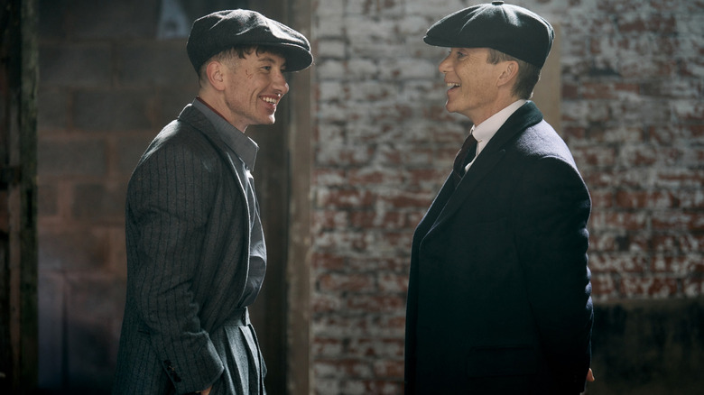 Cilian Murphy like Tommy Shelby and Barry Keogan as an unnamed character sharing laughter in a picture behind the scenes of the set of 