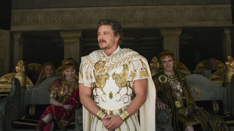 Pedro Pascal as Acacius standing with his hands folded in Gladiator II