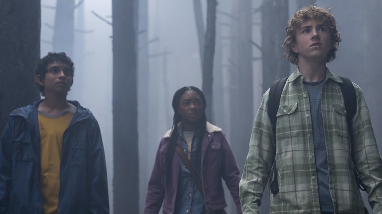 Grover, Annabeth, and Percy stand in foggy forest