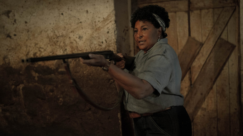 Pam Grier with a gun in Pet Sematary: Bloodlines