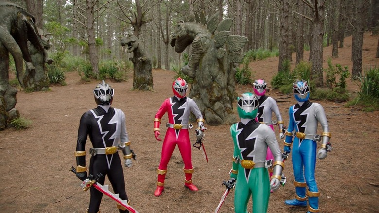 The Rangers looking up to the sky in Power Rangers Dino Fury