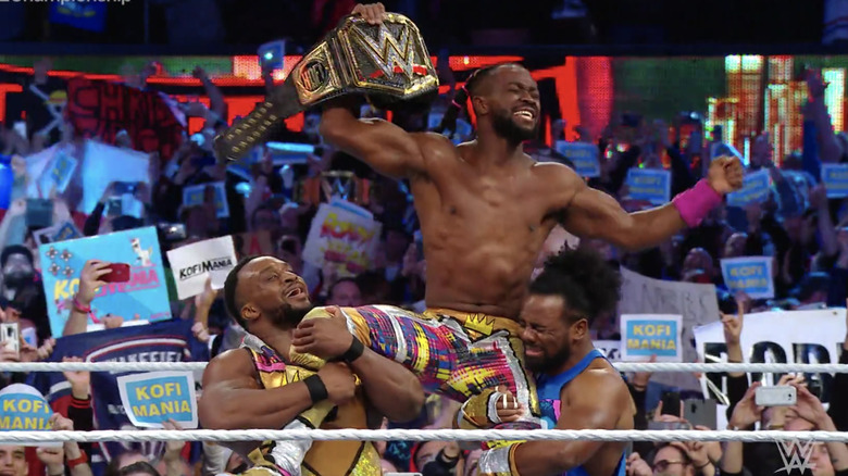 Kofi Kingston celebrates his WWE Championship victory with The New Day
