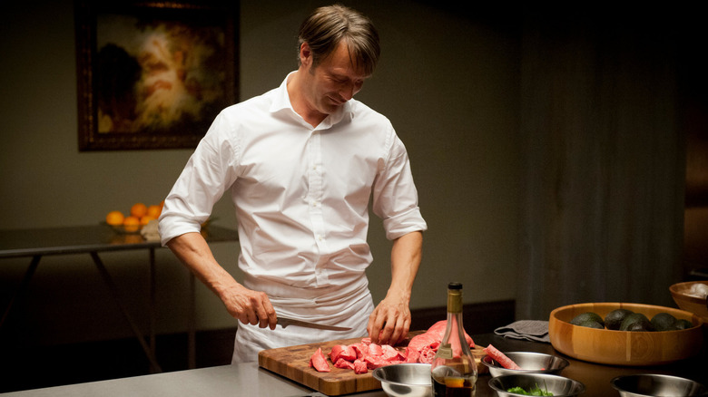 Mads Mikkelsen Hannibal cutting meat