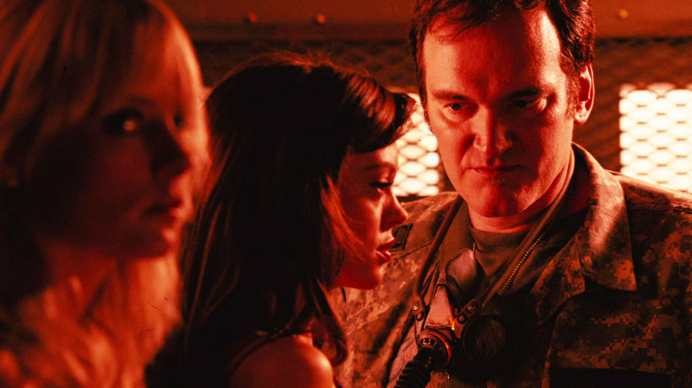 Quentin Tarantino as Lewis stares menacingly at his captives in Planet Terror