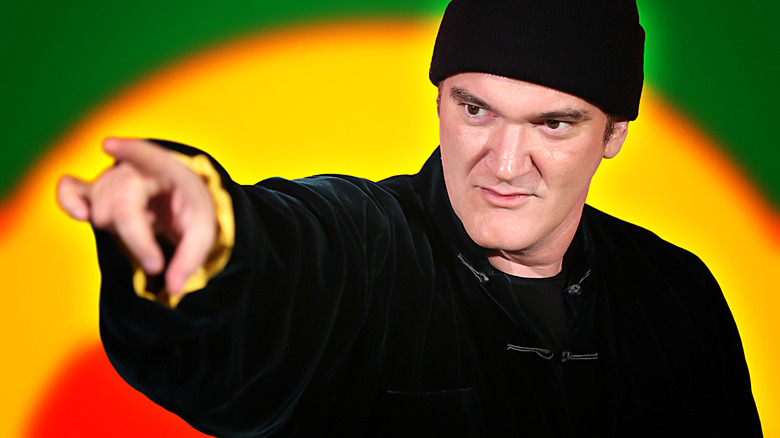 Quentin Tarantino pointing wearing hat