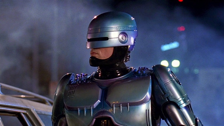 RoboCop standing on street in armor