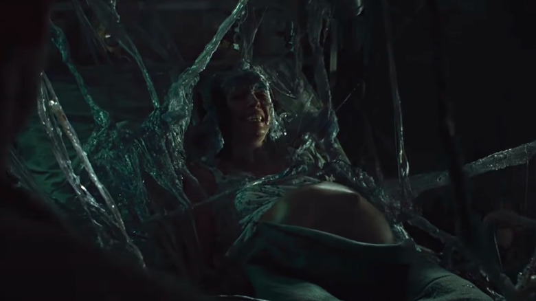 A pregnant woman trapped in a cocoon in Alien vs Predator Requiem