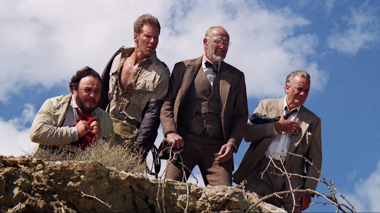 Indiana Jones and friends look over a cliff in Indiana Jones and the Last Crusade