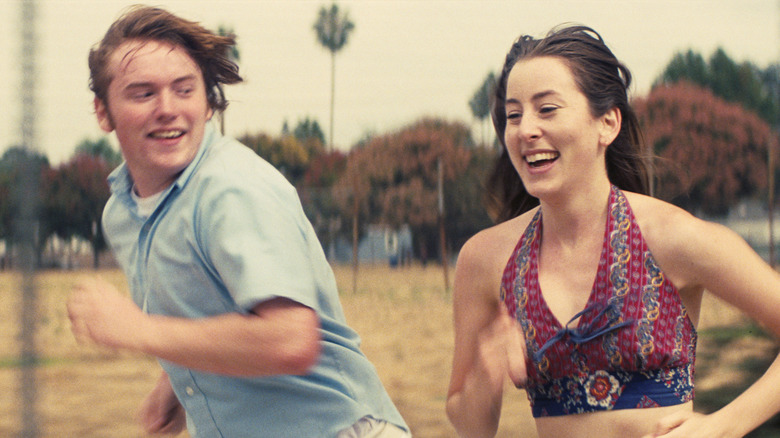 Cooper Hoffman and Alana Haim running