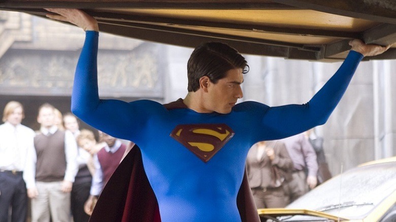 Superman holds a car over his head