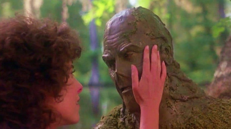 Alice touches Swamp Thing's face