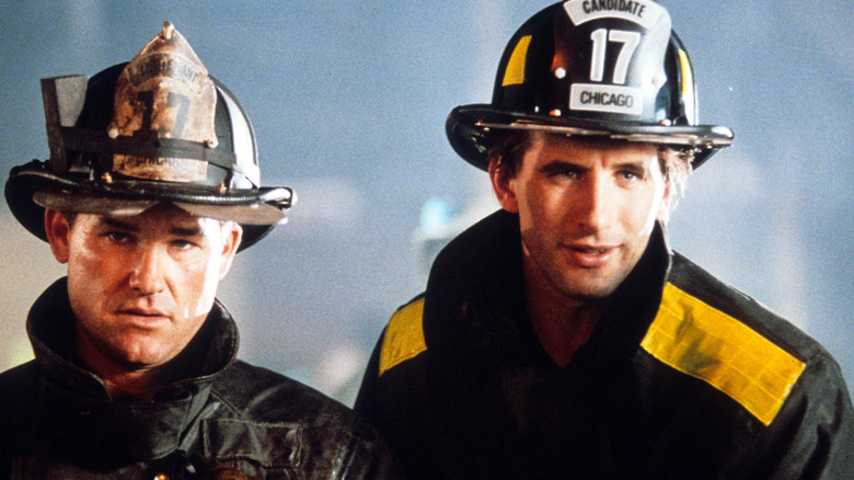 Kurt Russell and William Baldwin wear fire helmets