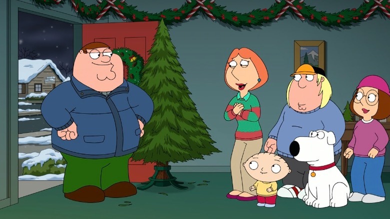 Griffin family with Christmas tree