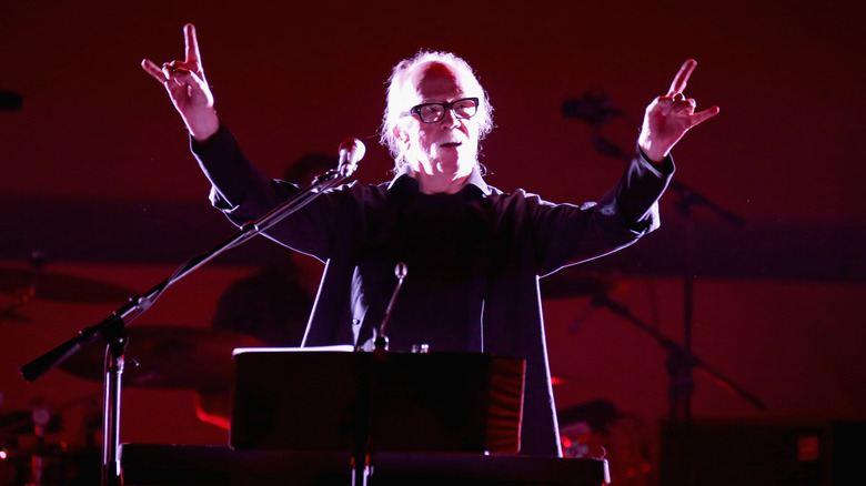 John Carpenter throws the horns