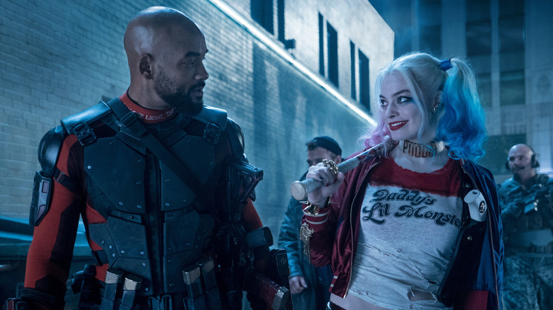 Deadshot and Harley Quinn look at each other in Suicide Squad