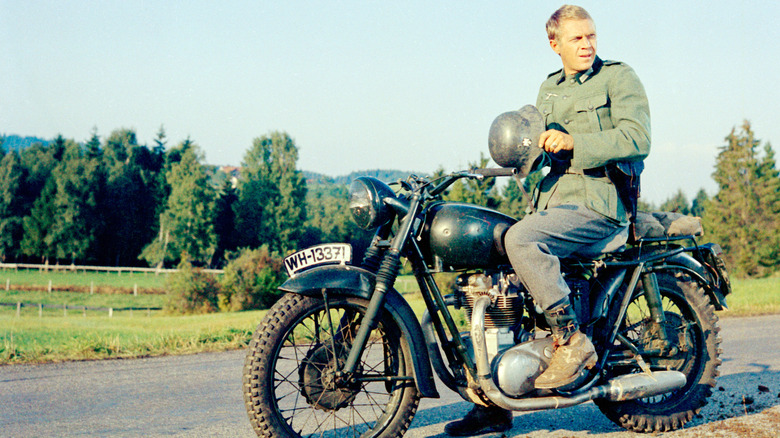 Steve McQueen and that famous motorcycle in a publicity image for The Great Escape