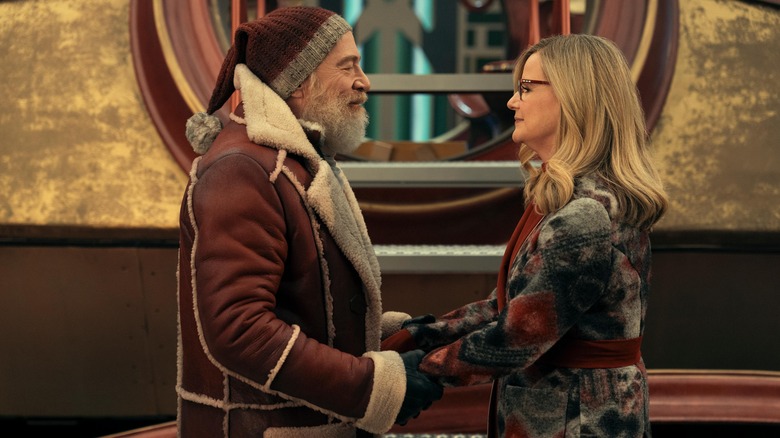 J.K. Simmons as Santa Clause holding hands with Bonnie Hunt as Mrs. Clause in Red One