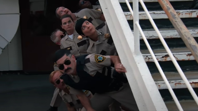 Still from Reno 911! The Hunt for QAnon