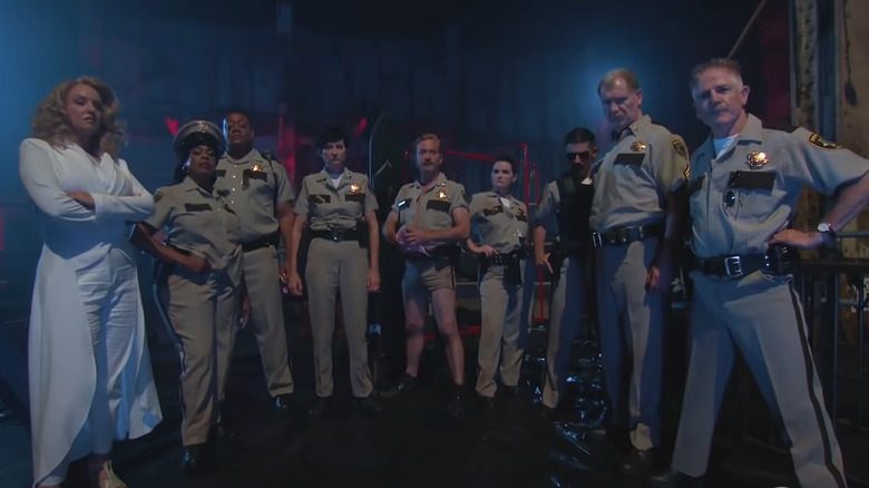 Still from Reno 911! The Hunt for QAnon