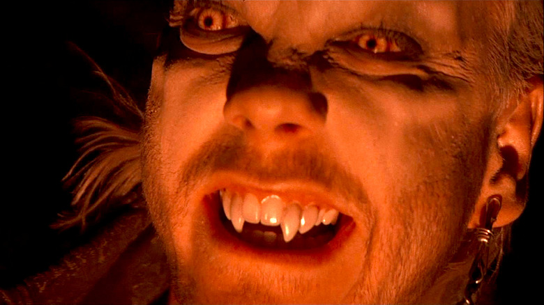 Kiefer Sutherland flashes his fangs at the camera in The Lost Boys