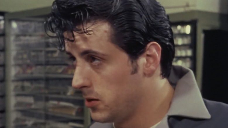 Sylvester Stallone as Stanley Rosiello looking at a someone off camera in The Lords of Flatbush