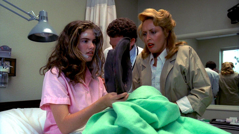 Heather Langenkamp and Ronee Blakley look at Freddy Krueger's hat in A Nightmare on Elm Street