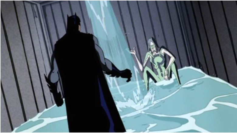 Batman and Riddler in flooding shipping crate