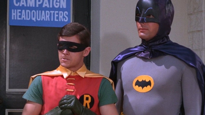 Robin and Batman from the 1966 Batman series facing the Batman's headquarters.