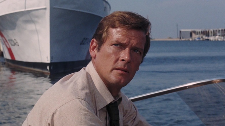 Roger Moore's James Bond looks as he stood in a live boat and looks up to death