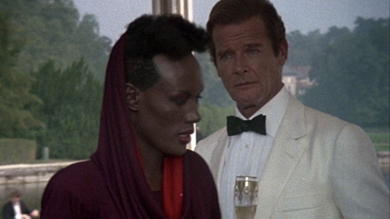 Roger Moore's James Bond watches Grace Jones' May Day walk past him A View to a Kill