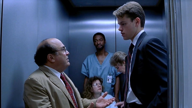 Danny DeVito as Deck talking to Matt Damon as Rudy in an elevator in The Rainmaker