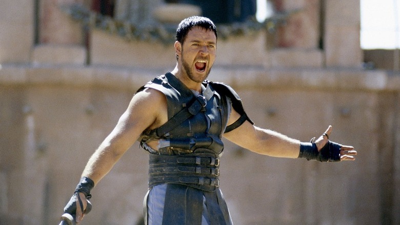 Russell Crowe yells to the crowd in a colosseum