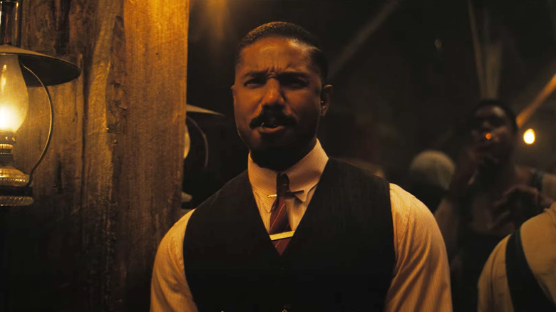 Michael B. Jordan as Eljiah enjoying a party in Sinners