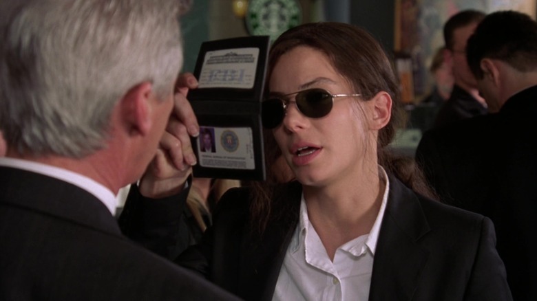 Gracie holding up her FBI badge in Miss Congeniality