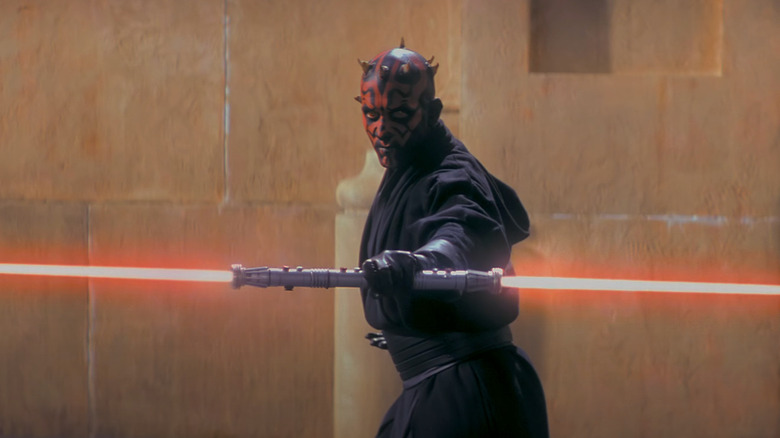 Darth Maul ignites his lightsaber in Star Wars: The Phantom Menace