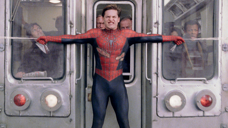 Tobey Maguire trying to stop a train in Spider-Man 2