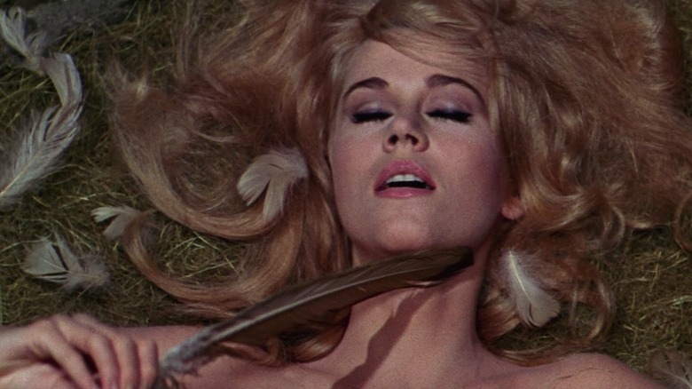 Barbarella plays with feathers