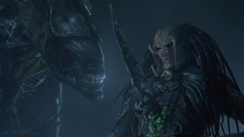 A Xenomorph stabbing a Predator