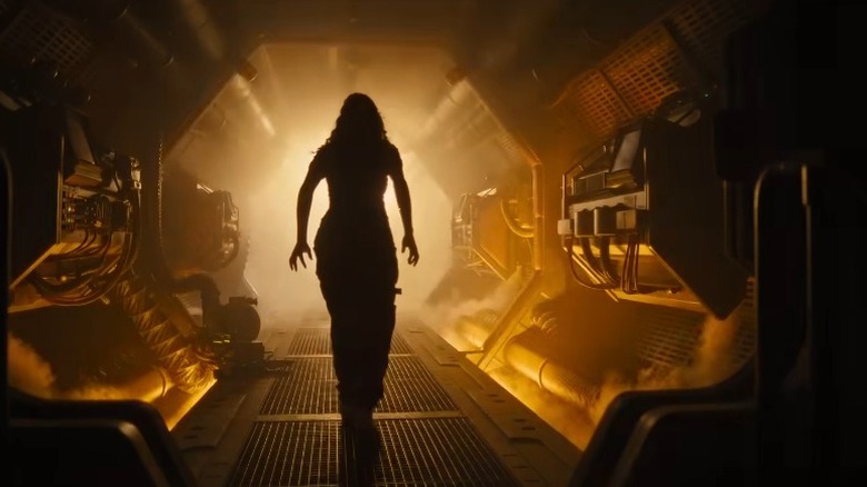 Person walking down spaceship corridor in Alien: Romulus