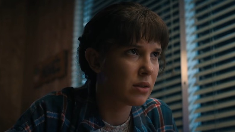 Eleven with a serious expression in Stranger Things