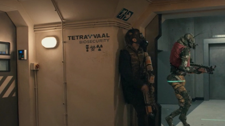 Soldiers hiding by Tetravaal logo