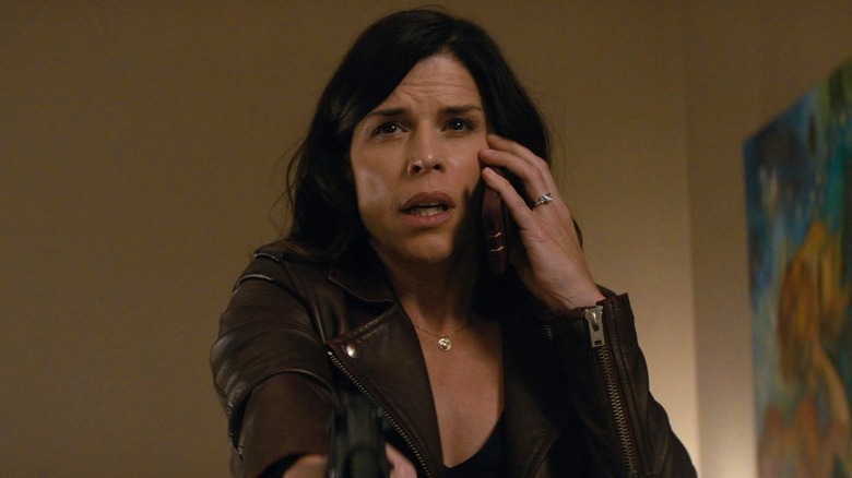 Neve Campbell on phone