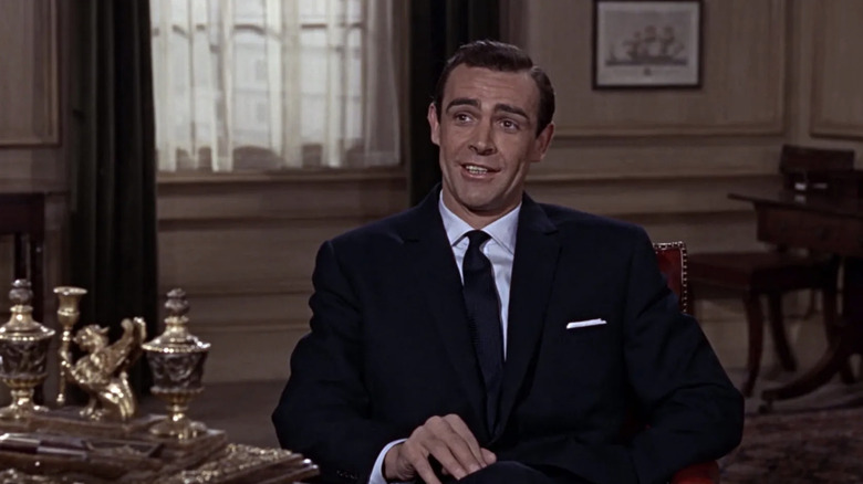 Sean Connery's James Bond sits in a chair in M's office in From Russia with Love