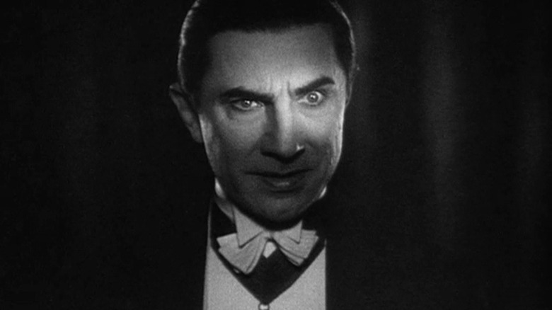 Bela Lugosi as Dracula, a light shining across his eyes