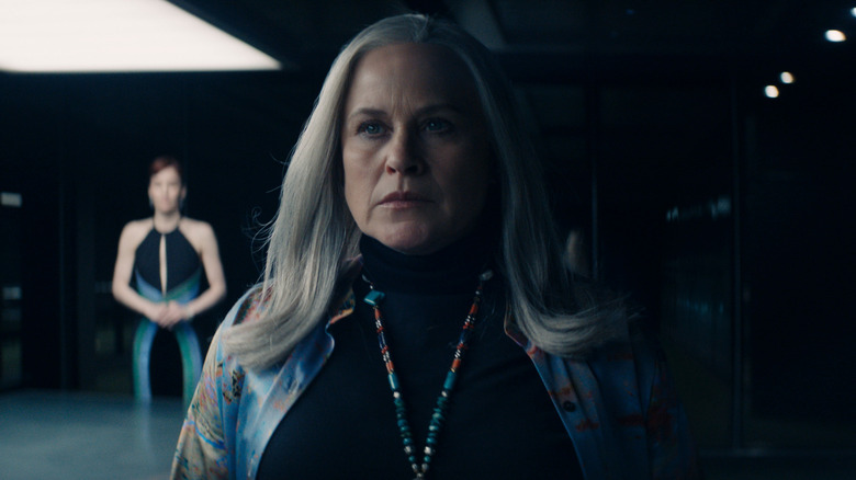 Patricia Arquette's Harmony Cobel in a dim-lit room on Severance