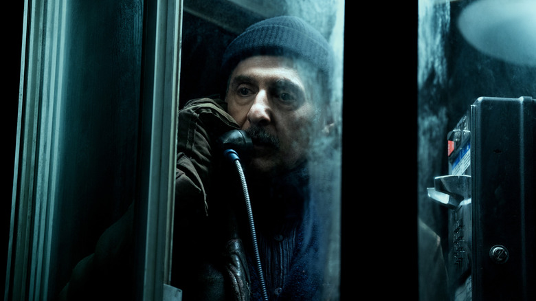 John Turturro as Irving B. making a call on a payphone in Severance season 2