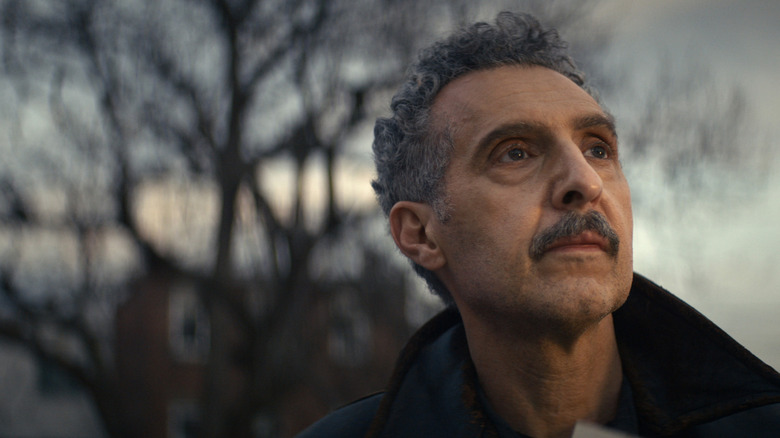 John Turturro as Irving Bailiff standing outdoors and looking at the sky in season 1 of Severance